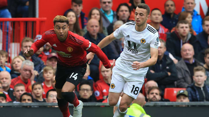 Manchester United's English midfielder Jesse Lingard (L) vies with Cardiff City's Irish defender Greg Cunningham during the English Premier League football match between Manchester United and Wolverhampton Wanderers at Old Trafford in Manchester, north west England, on September 22, 2018. (Photo by Lindsey PARNABY / AFP) / RESTRICTED TO EDITORIAL USE. No use with unauthorized audio, video, data, fixture lists, club/league logos or 'live' services. Online in-match use limited to 120 images. An additional 40 images may be used in extra time. No video emulation. Social media in-match use limited to 120 images. An additional 40 images may be used in extra time. No use in betting publications, games or single club/league/player publications. / (Photo credit should read LINDSEY PARNABY/AFP/Getty Images)