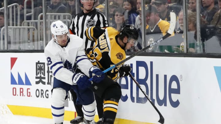 BOSTON, MA - OCTOBER 22: Toronto Maple Leafs left wing Andreas Johnsson (18) checks Boston Bruins right defenseman Charlie McAvoy (73) during a game between the Boston Bruins and the Toronto Maple Leafs on October 22, 2019, at TD Garden in Boston, Massachusetts. (Photo by Fred Kfoury III/Icon Sportswire via Getty Images)