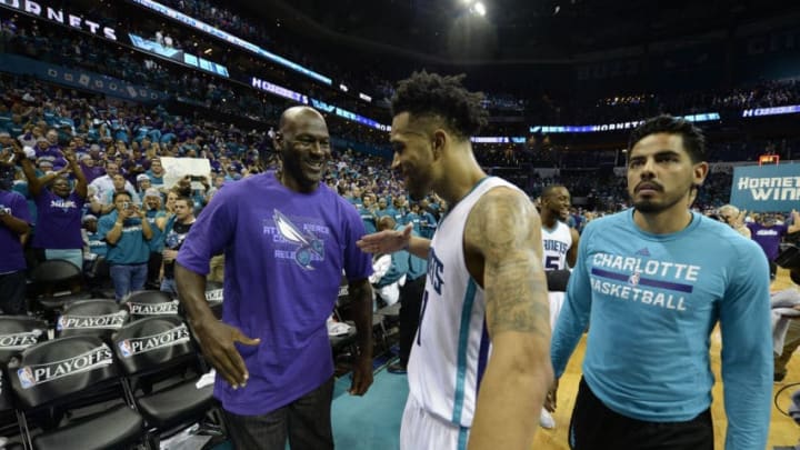 Charlotte Hornets owner Michael Jordan congratulates guard Courtney Lee (1) after the team defeated the Miami Heat on Monday, April 25, 2016, at Time Warner Cable Arena in Charlotte, N.C. (David T. Foster III/Charlotte Observer/TNS via Getty Images)