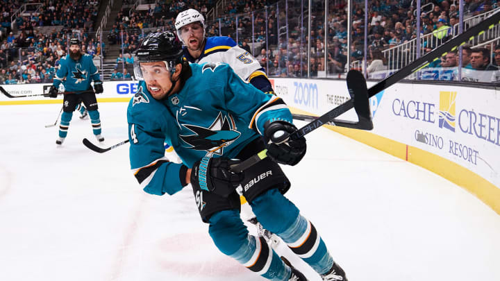 SAN JOSE, CA – DECEMBER 21: San Jose Sharks defenseman Brenden Dillon (4) holds off St. Louis Blues left wing David Perron (57) during the San Jose Sharks game versus the St. Louis Blues on December 21, 2019, at SAP Center at San Jose in San Jose, CA (Photo by Matt Cohen/Icon Sportswire via Getty Images)