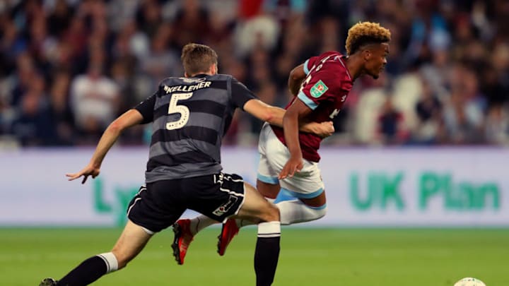 LONDON, ENGLAND - SEPTEMBER 26: Fiacre Kelleher of Macclesfield Town tackles Grady Diangana of West Ham United during the Carabao Cup Third Round match between West Ham United and Macclesfield Town at The London Stadium on September 26, 2018 in London, England. (Photo by Warren Little/Getty Images)