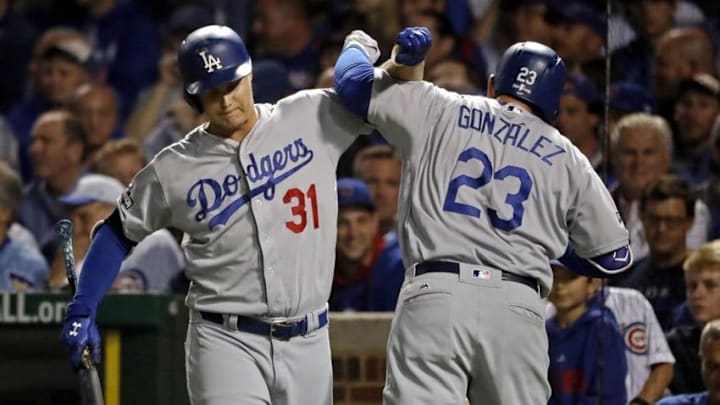 Oct 16, 2016; Chicago, IL, USA; Los Angeles Dodgers first baseman Adrian Gonzalez (23) celebrates with center fielder Joc Pederson (31) after hitting a solo home run during the second inning in game two of the 2016 NLCS playoff baseball series at Wrigley Field. Mandatory Credit: Jon Durr-USA TODAY Sports