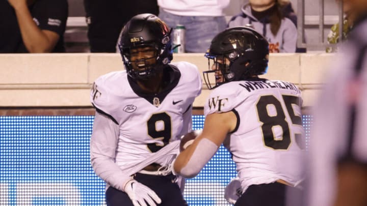 Sep 24, 2021; Charlottesville, Virginia, USA; Wake Forest Demon Deacons tight end Blake Whiteheart (85) celebrates with Demon Deacons wide receiver A.T. Perry (9) after catching a touchdown pass against the Virginia Cavaliers during the third quarter at Scott Stadium. Mandatory Credit: Geoff Burke-USA TODAY Sports