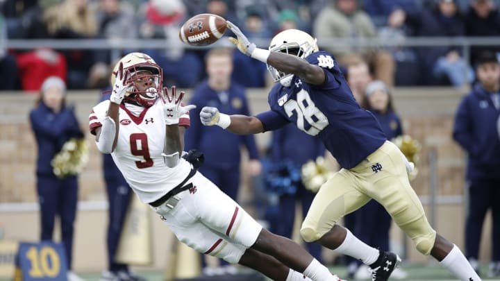 SOUTH BEND, IN – NOVEMBER 23: Kobay White #9 of the Boston College Eagles makes a 39-yard reception down to the one-yard line against TaRiq Bracy #28 of the Notre Dame Fighting Irish in the second quarter at Notre Dame Stadium on November 23, 2019 in South Bend, Indiana. (Photo by Joe Robbins/Getty Images)