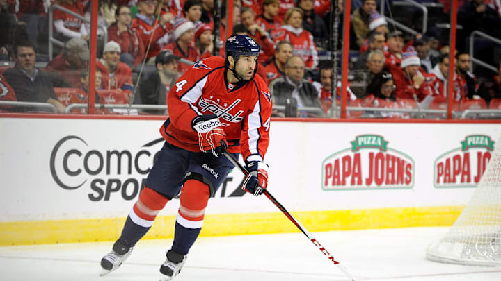 WASHINGTON, DC – JANUARY 22: Roman Hamrlik #44 of the Washington Capitals handles the puck against the Winnipeg Jets at the Verizon Center on January 22, 2013 in Washington, DC. (Photo by Greg Fiume/Getty Images)