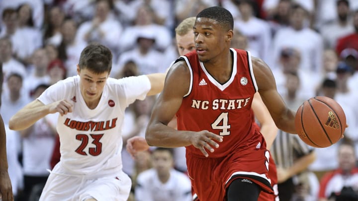 Jan 29, 2017; Louisville, KY, USA; North Carolina State Wolfpack guard Dennis Smith Jr. (4) dribbles the ball against the Louisville Cardinals during the first half at KFC Yum! Center. Mandatory Credit: Jamie Rhodes-USA TODAY Sports