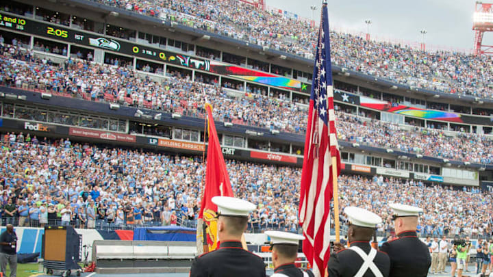 NASHVILLE, TN - SEPTEMBER 24: The colorguard presents the American Flag as the bench of the Tennessee Titans remains empty during the national anthem prior to a game between the Tennessee Titans and the Seattle Seahawks at Nissan Stadium on September 24, 2017 in Nashville, Tennessee. (Photo by Frederick Breedon/Getty Images)