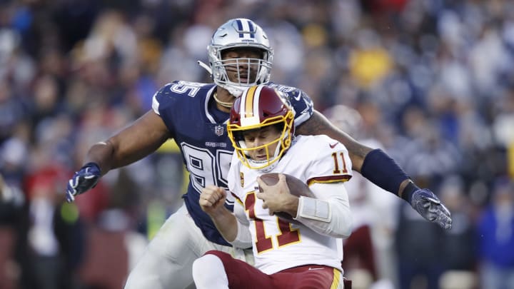 LANDOVER, MD – OCTOBER 21: David Irving #95 of the Dallas Cowboys sacks Alex Smith #11 of the Washington Redskins in the third quarter of the game at FedExField on October 21, 2018 in Landover, Maryland. The Redskins won 20-17. (Photo by Joe Robbins/Getty Images)