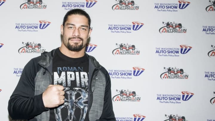 WASHINGTON, DC - JANUARY 28: WWE Wrestler Roman Reigns signs autographs during the Washington Auto Show at the Washington Convention Center in Washington DC on January 28, 2016. (Kris Connor/Getty Images)