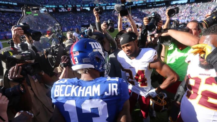 Sep 25, 2016; East Rutherford, NJ, USA; New York Giants wide receiver Odell Beckham Jr. (13) and Washington Redskins corner back Josh Norman (24) talk after a game at MetLife Stadium. Mandatory Credit: Brad Penner-USA TODAY Sports