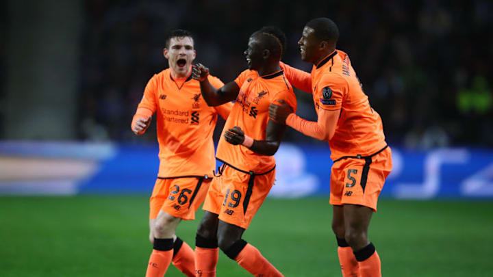 PORTO, PORTUGAL - FEBRUARY 14: Sadio Mane of Liverpool celebrates scoring the first goal with Georginio Wijnaldum and Andy Robertson during the UEFA Champions League Round of 16 First Leg match between FC Porto and Liverpool at Estadio do Dragao on February 14, 2018 in Porto, Portugal. (Photo by Julian Finney/Getty Images)