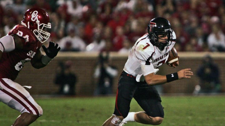 Quarterback Seth Doege #7 of the Texas Tech Red Raiders scrambles  (Photo by Brett Deering/Getty Images)