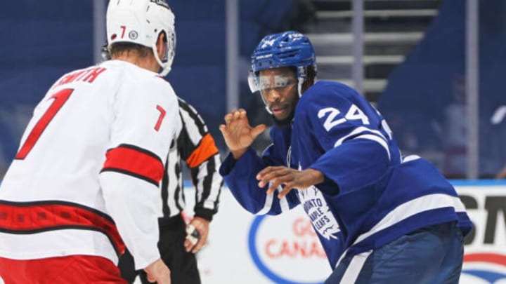 TORONTO, ON – FEBRUARY 7: Brendan Smith #7 of the Carolina Hurricanes engages Wayne Simmonds #24 of the Toronto Maple Leafs in a fight during an NHL game at Scotiabank Arena on February 7, 2022, in Toronto, Ontario, Canada. The Maple Leafs defeated the Hurricanes 4-3 in overtime. (Photo by Claus Andersen/Getty Images)