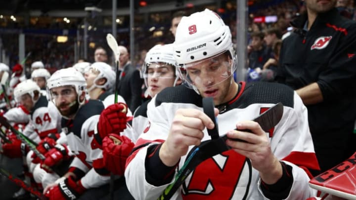 VANCOUVER, BC - NOVEMBER 10: Taylor Hall #9 of the New Jersey Devils tapes his stick during their NHL game against the Vancouver Canucks at Rogers Arena November 10, 2019 in Vancouver, British Columbia, Canada. (Photo by Jeff Vinnick/NHLI via Getty Images)"n