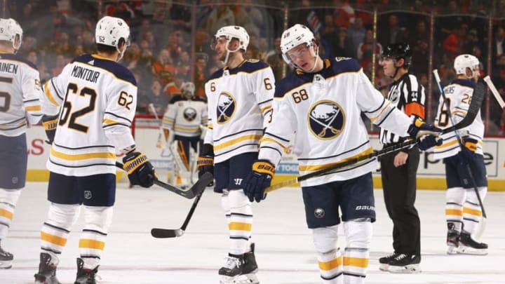 PHILADELPHIA, PA - DECEMBER 19: Brandon Montour #62, Marco Scandella #6, and Victor Olofsson #68 of the Buffalo Sabres react after a goal by the Philadelphia Flyers in the second period at the Wells Fargo Center on December 19, 2019 in Philadelphia, Pennsylvania. (Photo by Mitchell Leff/Getty Images)