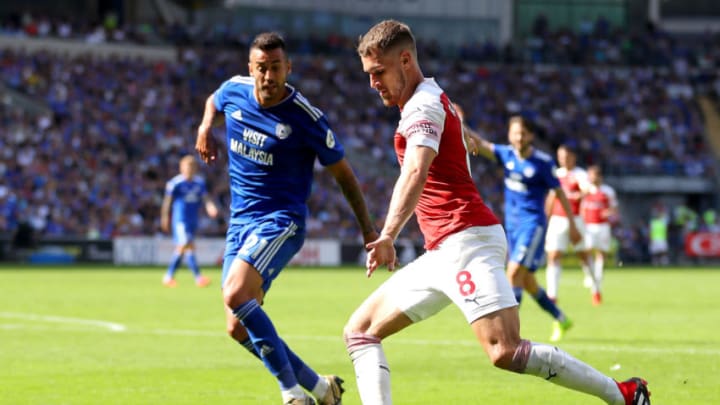 CARDIFF, WALES - SEPTEMBER 02: Aaron Ramsey of Arsenal is watched by Victor Camarasa of Cardiff City during the Premier League match between Cardiff City and Arsenal FC at Cardiff City Stadium on September 2, 2018 in Cardiff, United Kingdom. (Photo by Catherine Ivill/Getty Images)