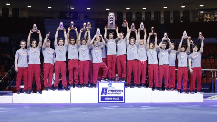 Apr 16, 2022; Norman, OK, USA; The Oklahoma Sooners gymnastic team celebrates with the NCAA second place trophy in the 2022 NCAA menÕs gymnastics championship at University of Oklahoma. Mandatory Credit: Alonzo Adams-USA TODAY Sports