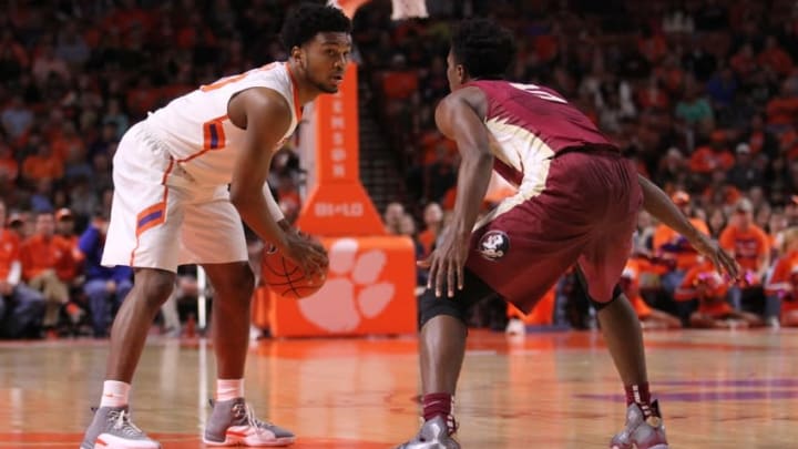 Jan 2, 2016; Greenville, SC, USA; Clemson Tigers guard Gabe DeVoe (10) protects the ball as Florida State Seminoles guard Malik Beasley (5) defends during the first half at Bon Secours Wellness Arena. Mandatory Credit: Dawson Powers-USA TODAY Sports