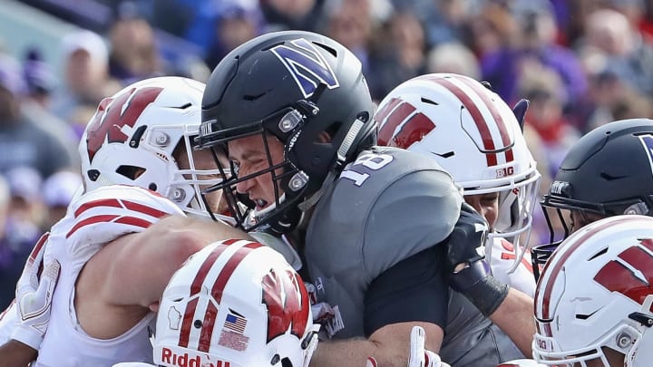 EVANSTON, IL – OCTOBER 27: Clayton Thorson #18 of the Northwestern Wildcats is stood up short of the goal line by members of the Wisconsin Badgers defense including T.J. Edwards #53 and Andrew Van Ginkel #17 at Ryan Field on October 27, 2018 in Evanston, Illinois. (Photo by Jonathan Daniel/Getty Images)