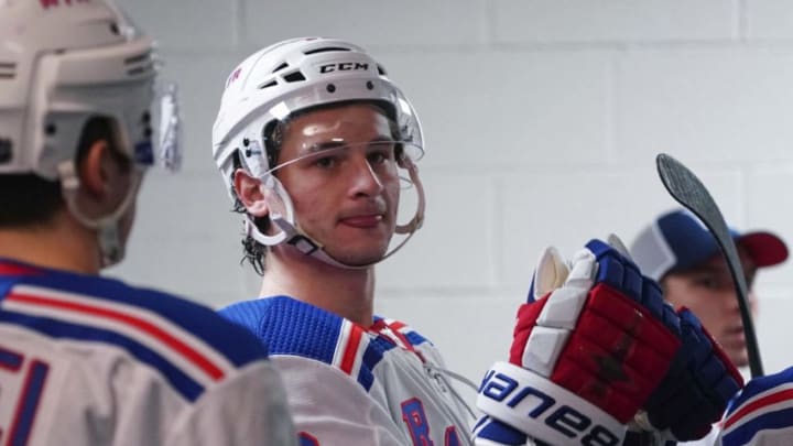 Feb 21, 2020; Raleigh, North Carolina, USA; New York Rangers right wing Julien Gauthier (12) waits outside the locker room against the Carolina Hurricanes at PNC Arena. The New York Rangers defeated the Carolina Hurricanes 5-2. Mandatory Credit: James Guillory-USA TODAY Sports