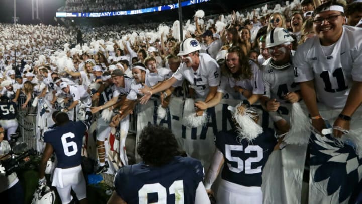 Sep 18, 2021; University Park, Pennsylvania, USA; Penn State Nittany Lion players celebrate with members of the Penn State student section following the competition of the game against the Auburn Tigers at Beaver Stadium. Penn State defeated Auburn 28-20. Mandatory Credit: Matthew OHaren-USA TODAY Sports