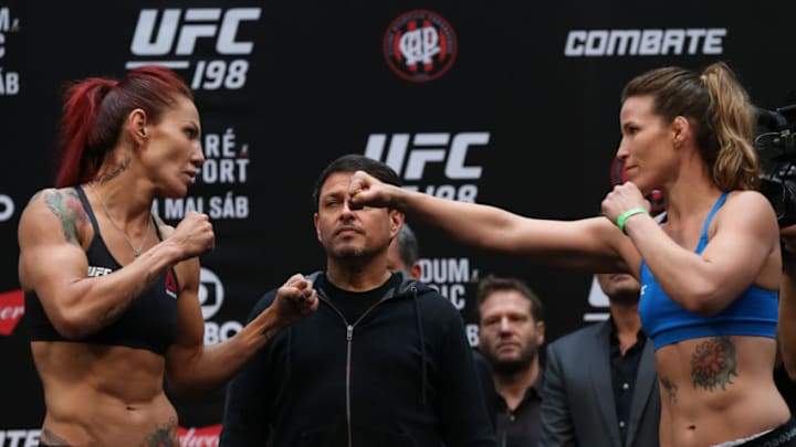 CURITIBA, BRAZIL - MAY 13: (L-R) Opponents Cris Cyborg Justino of Brazil and Leslie Smith of the United States face off during the UFC 198 weigh-in at Arena da Baixada stadium on May 13, 2016 in Curitiba, Brazil. (Photo by Buda Mendes/Getty Images)