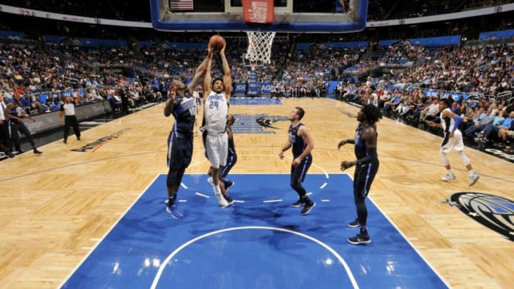 ORLANDO, FL - APRIL 4: Khem Birch #24 of the Orlando Magic rebounds the ball during the game against the Dallas Mavericks on April 4, 2018 at Amway Center in Orlando, Florida. NOTE TO USER: User expressly acknowledges and agrees that, by downloading and or using this photograph, User is consenting to the terms and conditions of the Getty Images License Agreement. Mandatory Copyright Notice: Copyright 2018 NBAE (Photo by Fernando Medina/NBAE via Getty Images)