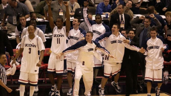 5 APR 2004: Members of the University of Connecticut basketball team rush off the bench in celebration at the end of the game during the final game of the NCAA Division I Men’s Basketball Championship held at the Alamodome in San Antonio, TX. University of Connecticut defeated Georgia Tech 82-73 to win the national title. Brett Wilhelm/NCAA Photos via Getty Images