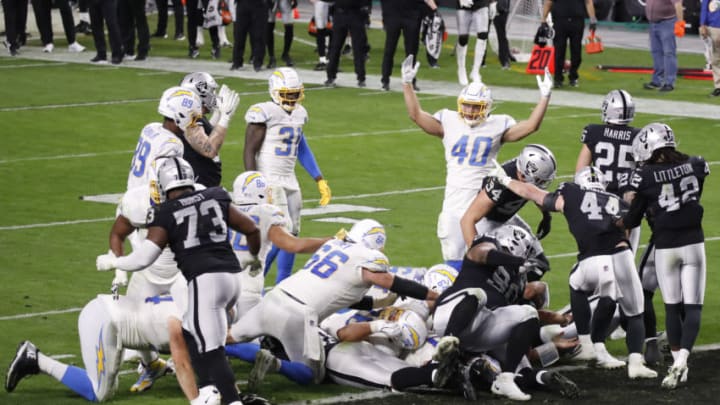 LAS VEGAS, NEVADA - DECEMBER 17: Tight end Jared Rice #40 of the Los Angeles Chargers reacts after teammate quarterback Justin Herbert #10 scored the game-winning touchdown during overtime against the Las Vegas Raiders at Allegiant Stadium on December 17, 2020 in Las Vegas, Nevada. The Chargers won 30-37. (Photo by Christian Petersen/Getty Images)