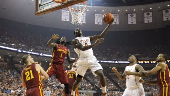 Feb 21, 2015; Austin, TX, USA; Texas Longhorns guard Kendal Yancy (0) shoots against Iowa State Cyclones forward Jameel McKay (1) during the first half at the Frank Erwin Special Events Center. Mandatory Credit: Brendan Maloney-USA TODAY
