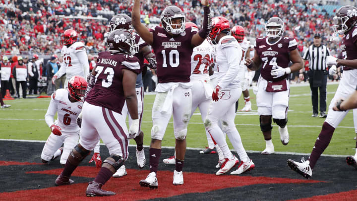 Keytaon Thompson #10 of the Mississippi State Bulldogs reacts after rushing for a 14-yard touchdown