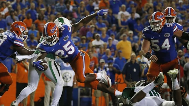 Sep 17, 2016; Gainesville, FL, USA; Florida Gators running back Jordan Scarlett (25) carries the ball against the North Texas Mean Green during the second half at Ben Hill Griffin Stadium. Florida Gators defeated the North Texas Mean Green 32-0. Mandatory Credit: Kim Klement-USA TODAY Sports