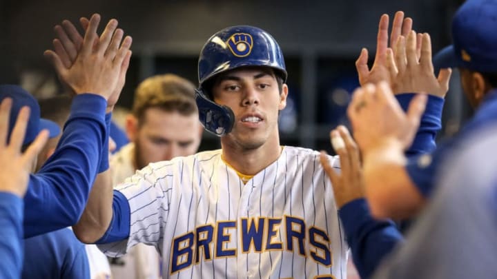 MILWAUKEE, WISCONSIN - SEPTEMBER 08: Christian Yelich #22 of the Milwaukee Brewers celebrates with teammates after scoring a run in the fourth inning against the Chicago Cubs at Miller Park on September 08, 2019 in Milwaukee, Wisconsin. (Photo by Dylan Buell/Getty Images)