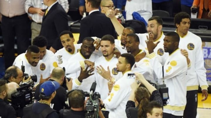 Oct 27, 2015; Oakland, CA, USA; The Golden State Warriors celebrate receiving their 2014-2015 NBA Championship rings before the game against the New Orleans Pelicans at Oracle Arena. Mandatory Credit: Kyle Terada-USA TODAY Sports