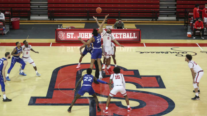 Mar 6, 2021; Queens, New York, USA; Seton Hall Pirates center Ike Obiagu (21) and St. JohnÕs Red Storm forward Julian Champagnie (2) jump for the opening tip-off at Carnesecca Arena. Mandatory Credit: Wendell Cruz-USA TODAY Sports