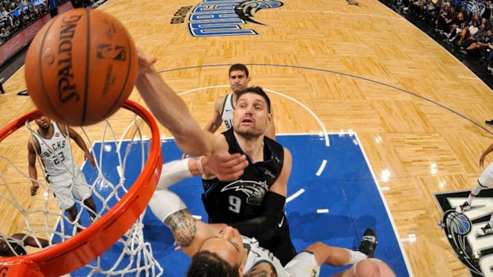 ORLANDO, FL - JANUARY 19: Nikola Vucevic #9 of the Orlando Magic drives to the basket during the game against the Milwaukee Bucks on January 19, 2019 at Amway Center in Orlando, Florida. NOTE TO USER: User expressly acknowledges and agrees that, by downloading and or using this photograph, User is consenting to the terms and conditions of the Getty Images License Agreement. Mandatory Copyright Notice: Copyright 2019 NBAE (Photo by Fernando Medina/NBAE via Getty Images)