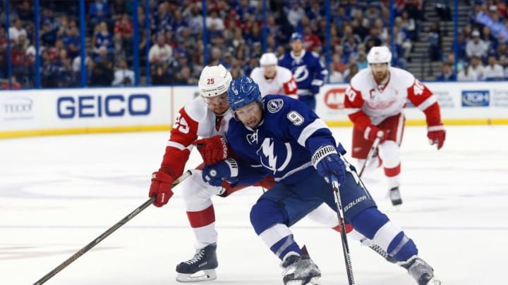 Oct 13, 2016; Tampa, FL, USA; Detroit Red Wings defenseman Mike Green (25) and center Tyler Johnson (9) skate with he puck during the third period at Amalie Arena. Tampa Bay Lightning defeated the Detroit Red Wings 6-4. Mandatory Credit: Kim Klement-USA TODAY Sports