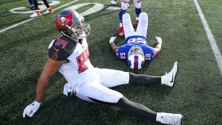 ORCHARD PARK, NY – OCTOBER 22: Cameron Brate #84 of the Tampa Bay Buccaneers and Matt Milano #58 of the Buffalo Bills on the field after an NFL game on October 22, 2017 at New Era Field in Orchard Park, New York. (Photo by Tom Szczerbowski/Getty Images)