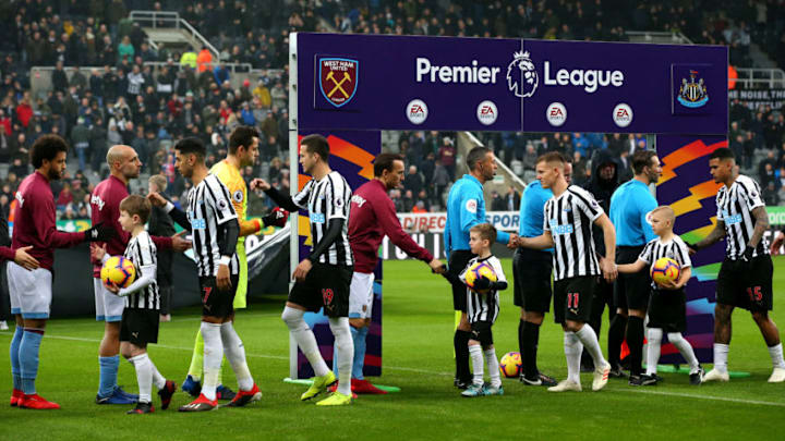 NEWCASTLE UPON TYNE, ENGLAND - DECEMBER 01: Players from both team's shake hands infront of branding for the This Is Everyones Game campaign prior to the Premier League match between Newcastle United and West Ham United at St. James Park on December 1, 2018 in Newcastle upon Tyne, United Kingdom. (Photo by Alex Livesey/Getty Images)