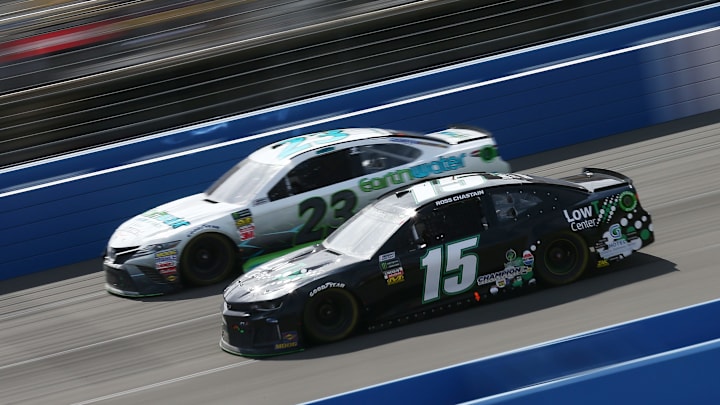 FONTANA, CA – MARCH 18: Ross Chastain, driver of the #15 LowT Center Chevrolet, and Gray Gaulding, driver of the #23 Earthwater Toyota (Photo by Sarah Crabill/Getty Images)