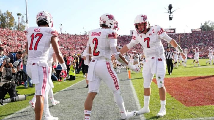 Utah Utes running back Micah Bernard (2) celebrates a touchdown with quarterback Cameron Rising (7) and wide receiver Devaughn Vele (17) during the first quarter of the Rose Bowl in Pasadena, Calif. on Jan. 1, 2022.College Football Rose Bowl