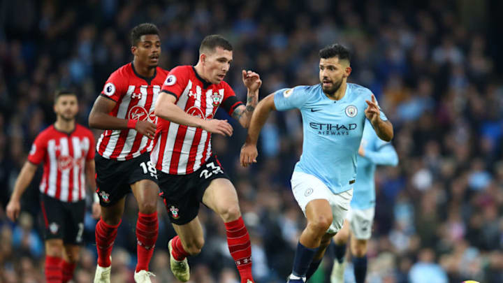 MANCHESTER, ENGLAND – NOVEMBER 04: Sergio Aguero of Manchester City runs with the ball under pressure from Pierre-Emile Hojbjerg of Southampton during the Premier League match between Manchester City and Southampton FC at Etihad Stadium on November 4, 2018 in Manchester, United Kingdom. (Photo by Clive Brunskill/Getty Images)