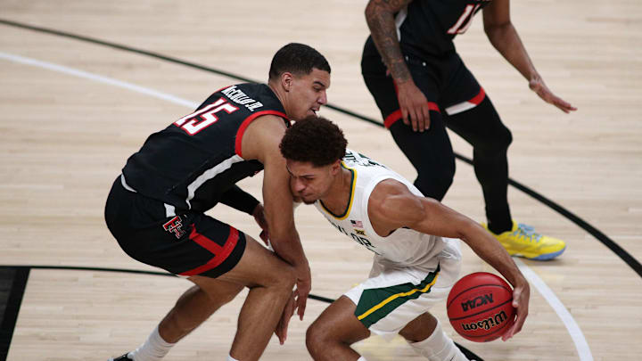 Jan 16, 2021; Lubbock, Texas, USA; Texas Tech Red Raiders guard Kevin McCullar (15) tries to block Baylor Bears guard MaCio Teague (31) in the first half at United Supermarkets Arena. Mandatory Credit: Michael C. Johnson-USA TODAY Sports