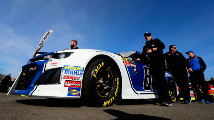 FONTANA, CA - MARCH 18: Crew members for the #88 Nationwide Chevrolet, driven by Alex Bowman (not pictured), push the car in the garage area prior to the Monster Energy NASCAR Cup Series Auto Club 400 at Auto Club Speedway on March 18, 2018 in Fontana, California. (Photo by Jonathan Ferrey/Getty Images)