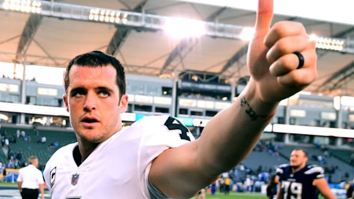 CARSON, CA - DECEMBER 31: Derek Carr #4 of the Oakland Raiders reacts as he leaves the field after 30-10 loss to the Los Angeles Chargers at StubHub Center on December 31, 2017 in Carson, California. (Photo by Harry How/Getty Images)