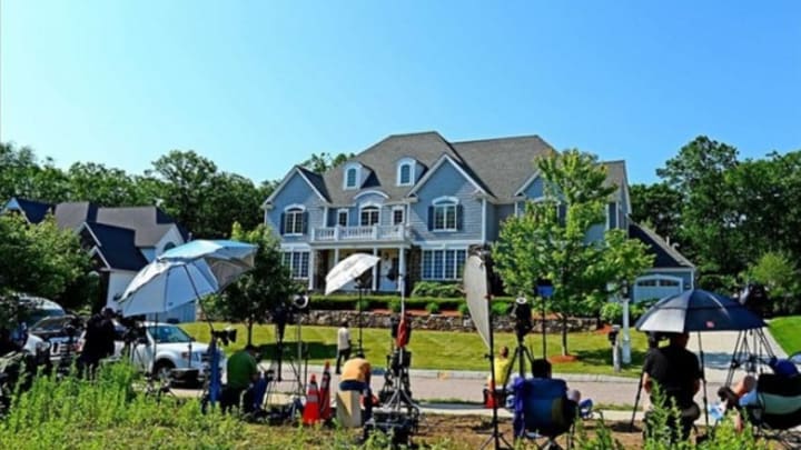 June 21 2013; North Attleborough, MA, USA; Media members stake out in front of the house of New England Patriots tight end Aaron Hernandez. Mandatory Credit: Andrew Weber-USA TODAY Sports