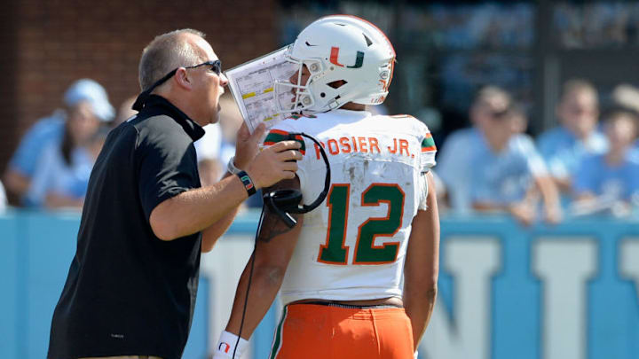 CHAPEL HILL, NC - OCTOBER 28: Head coach Mark Richt talks with Malik Rosier
