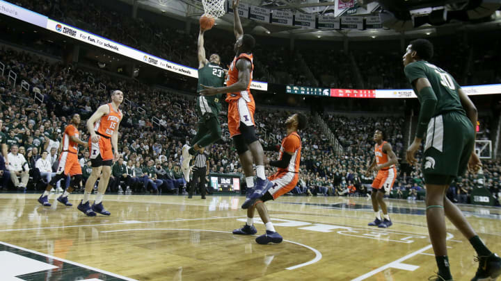 EAST LANSING, MI – JANUARY 2: Xavier Tillman #23 of the Michigan State Spartans goes up for a dunk against Kofi Cockburn #21 of the Illinois Fighting Illini during the first half at Breslin Center on January 2, 2020, in East Lansing, Michigan. (Photo by Duane Burleson/Getty Images)