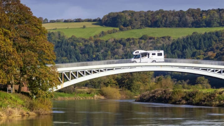 LLANDOGO, WALES - OCTOBER 15: A camper van travels from the England to Wales over Bigsweir Bridge which spans the River Wye between Wales and England on October 15, 2020 in Llandogo, Wales. The Welsh First Minister Mark Drakeford said that people from parts of England, Scotland and Northern Ireland with high rates of Covid-19 infection would be banned from traveling to Wales starting Friday. (Photo by Matthew Horwood/Getty Images)