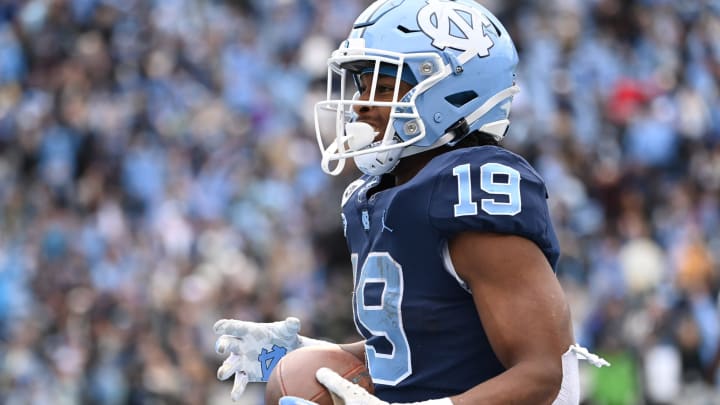 Nov 6, 2021; Chapel Hill, North Carolina, USA; North Carolina Tar Heels running back Ty Chandler (19) reacts after scoring a touchdown in the fourth quarter at Kenan Memorial Stadium. Mandatory Credit: Bob Donnan-USA TODAY Sports